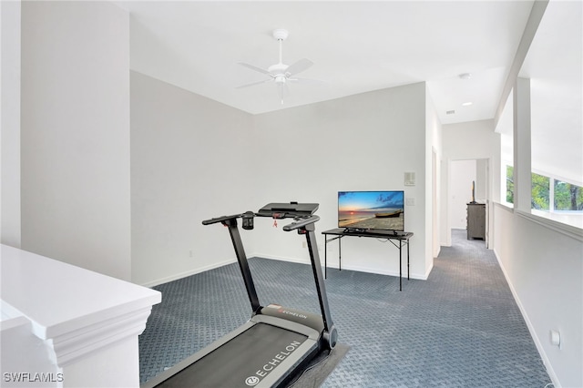 workout room with carpet, baseboards, and ceiling fan