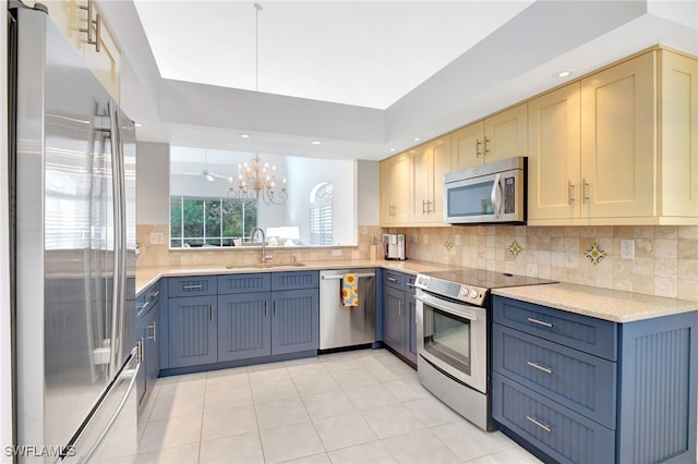 kitchen featuring a sink, light tile patterned floors, backsplash, and stainless steel appliances