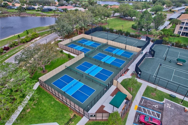 bird's eye view with a residential view and a water view