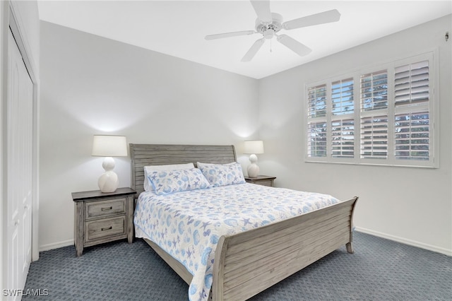 carpeted bedroom with baseboards and ceiling fan