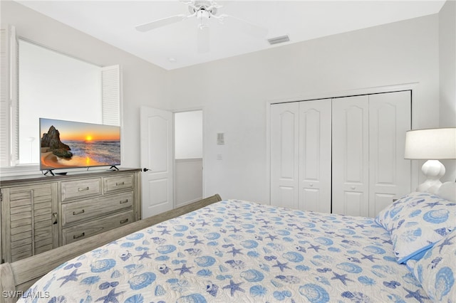 bedroom featuring a closet, visible vents, and ceiling fan