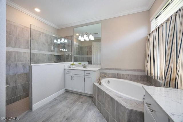 bathroom featuring a bath, a walk in shower, crown molding, and vanity