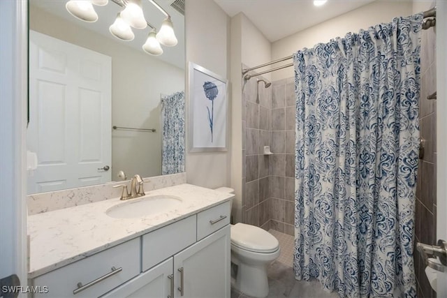 full bathroom with visible vents, vanity, a shower stall, and toilet