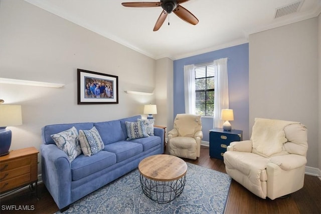 living room featuring baseboards, visible vents, a ceiling fan, hardwood / wood-style floors, and crown molding