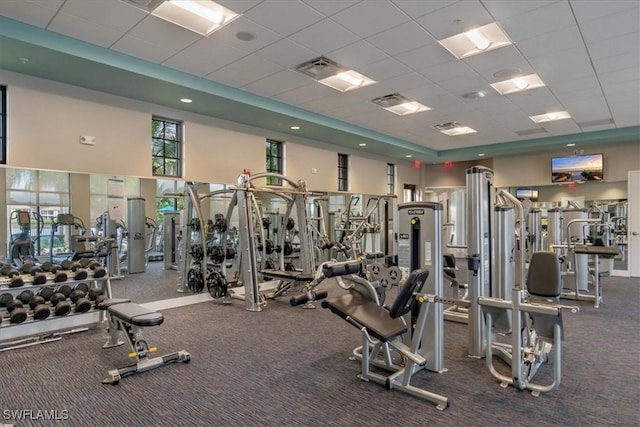 exercise room featuring a drop ceiling