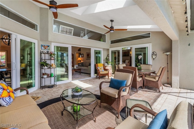 view of patio featuring an outdoor hangout area, a ceiling fan, and outdoor dining space