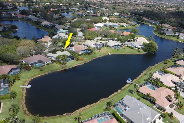 birds eye view of property featuring a water view and a residential view