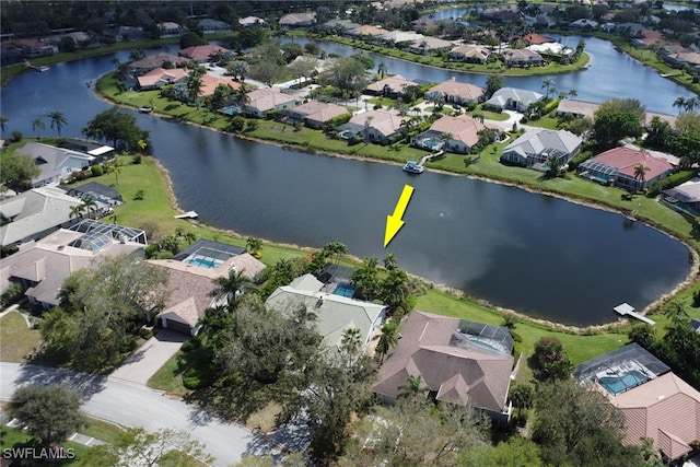 aerial view with a water view and a residential view