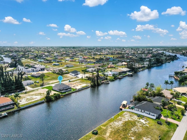 aerial view with a residential view and a water view