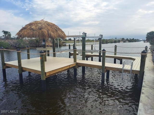 view of dock with a water view and boat lift