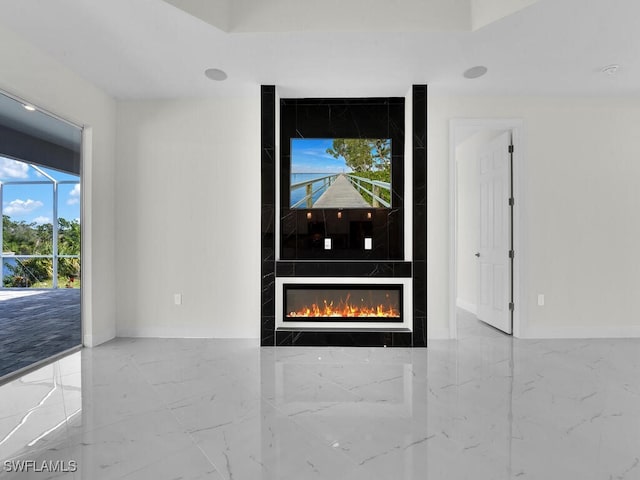 details featuring baseboards and a high end fireplace