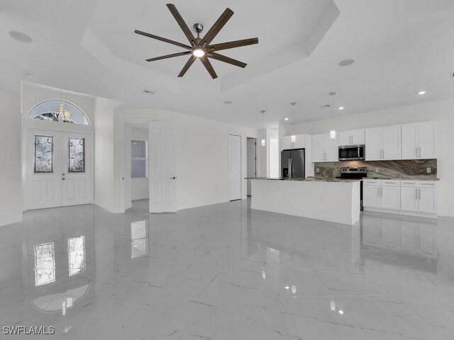 interior space featuring visible vents, recessed lighting, french doors, marble finish floor, and a raised ceiling