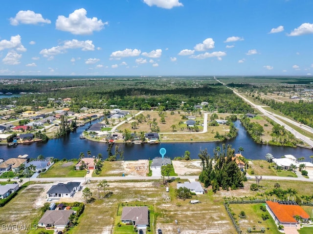 aerial view featuring a water view and a residential view