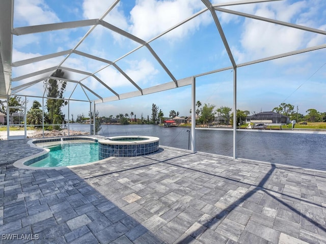 view of pool featuring glass enclosure, a water view, a patio area, and a pool with connected hot tub