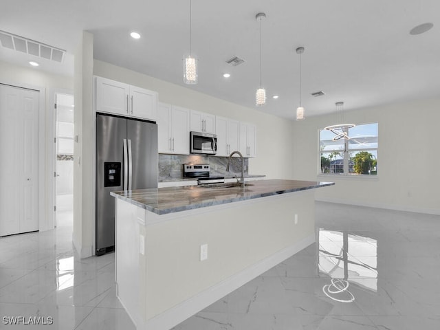 kitchen featuring visible vents, dark stone counters, appliances with stainless steel finishes, marble finish floor, and a sink