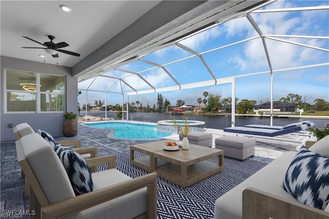 view of pool with a water view, a lanai, outdoor lounge area, a ceiling fan, and a patio