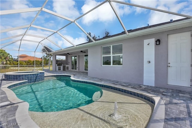 view of pool with a patio, a pool with connected hot tub, a lanai, and ceiling fan