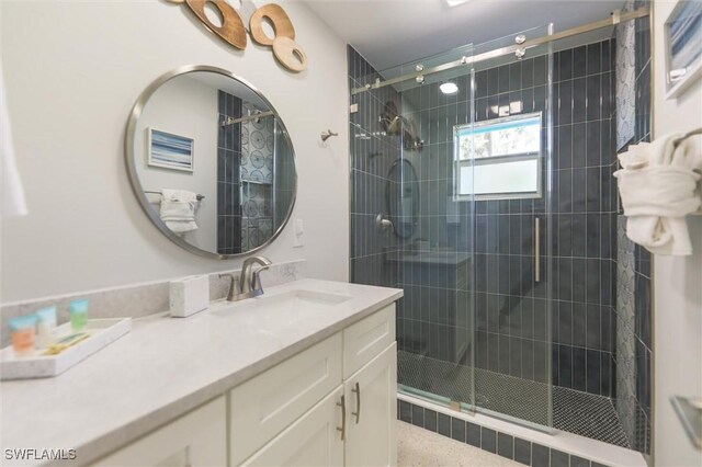 bathroom featuring a stall shower and vanity