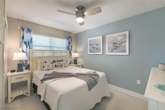 bedroom with ceiling fan and baseboards