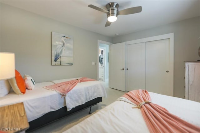 bedroom with ceiling fan and a closet