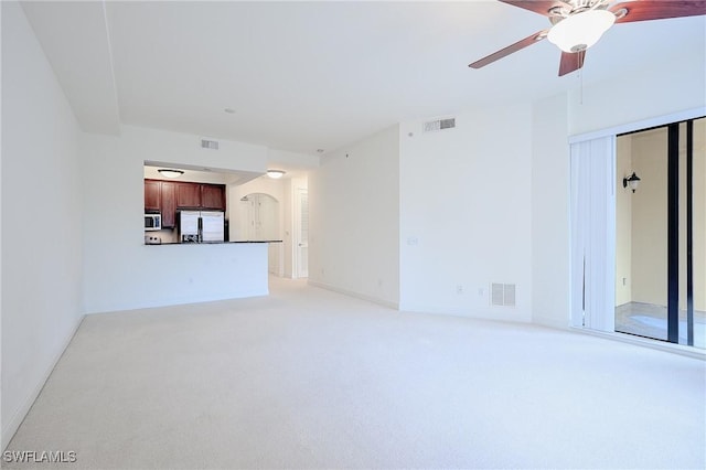 23159 Amgci Way Unit 3108, Estero, FL 33928 - unfurnished living room with light carpet, arched walkways, ceiling fan, and baseboards