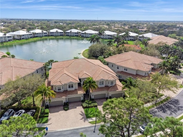 aerial view with a residential view and a water view