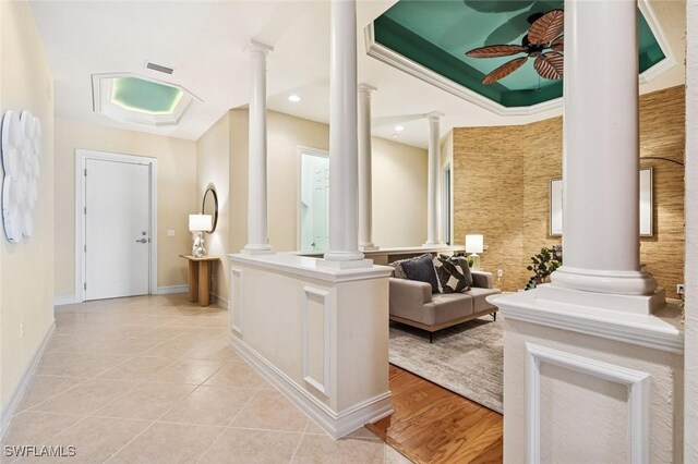 interior space with light tile patterned floors, recessed lighting, visible vents, baseboards, and decorative columns