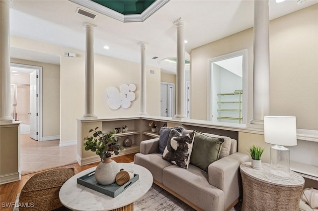 living room featuring decorative columns, recessed lighting, visible vents, wood finished floors, and baseboards