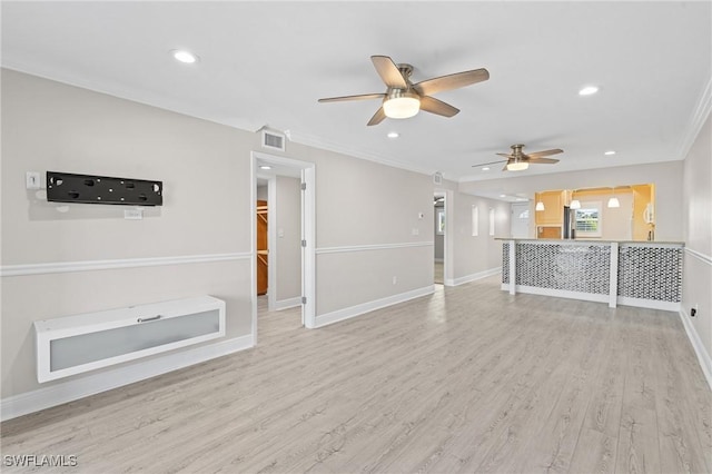 unfurnished living room with recessed lighting, wood finished floors, visible vents, baseboards, and crown molding