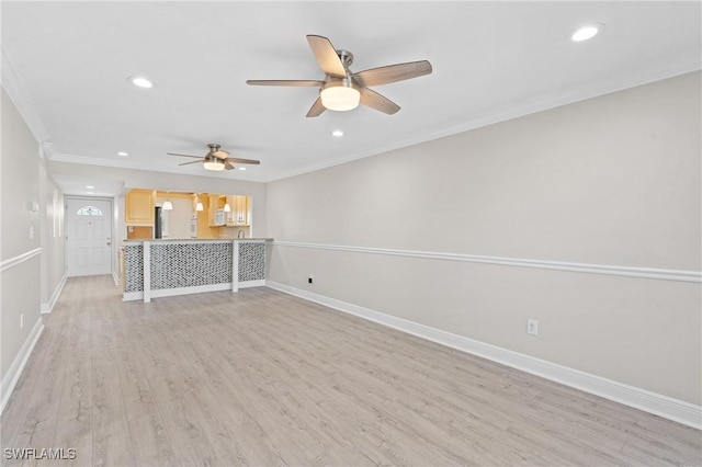 unfurnished living room with ornamental molding, recessed lighting, light wood-style flooring, and baseboards