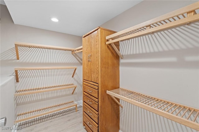 walk in closet featuring light wood-style flooring