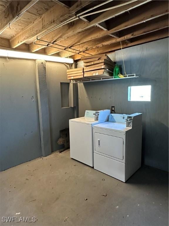 washroom with laundry area and washer and dryer