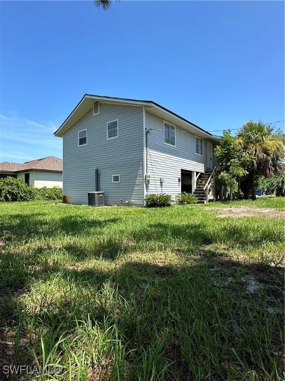 view of side of home with stairway