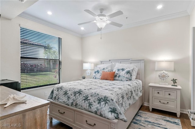 bedroom with dark wood-style floors, baseboards, ornamental molding, and ceiling fan