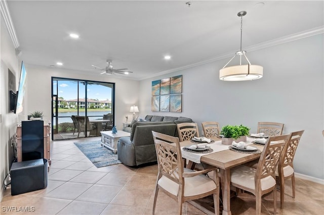 dining space featuring recessed lighting, ornamental molding, and light tile patterned flooring