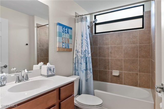 bathroom with shower / bath combination with curtain, vanity, and toilet