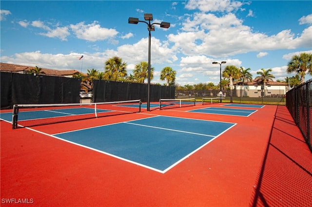 view of sport court with community basketball court and fence