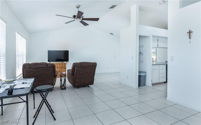 living room featuring light tile patterned floors, visible vents, and ceiling fan