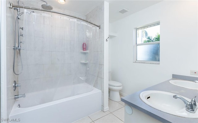 full bath with a sink, visible vents, shower / bath combo with shower curtain, and tile patterned floors