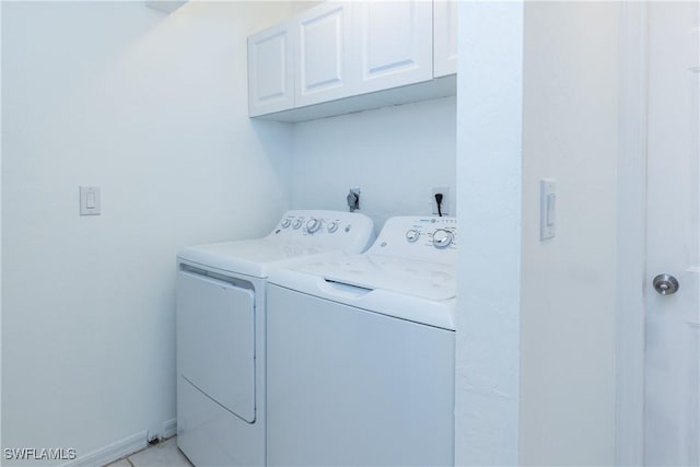 laundry room featuring washer and clothes dryer and cabinet space