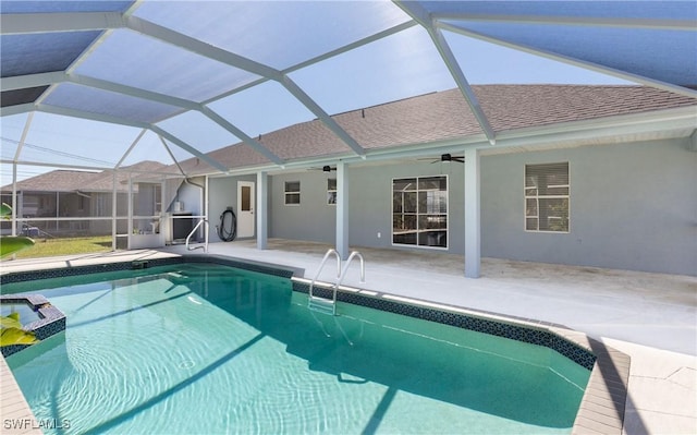 view of pool with a patio area, a lanai, a pool with connected hot tub, and ceiling fan