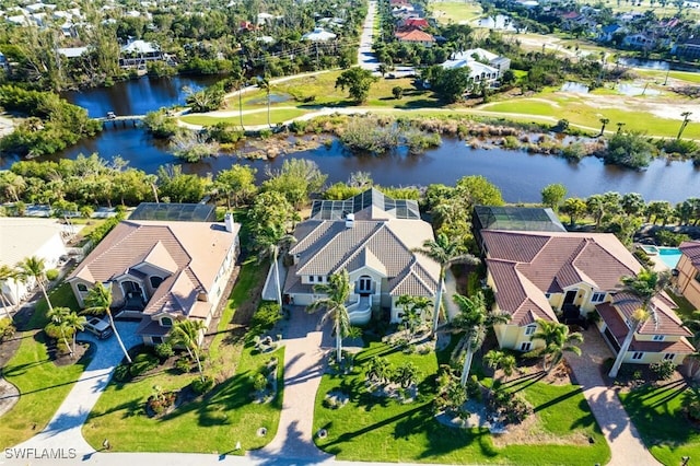 bird's eye view with a water view and a residential view