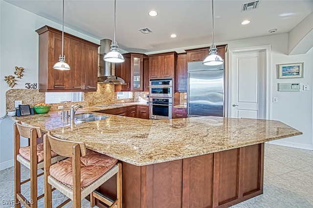 kitchen with visible vents, appliances with stainless steel finishes, backsplash, and a sink