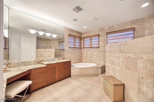 bathroom featuring visible vents, tile walls, tile patterned flooring, a walk in shower, and a bath