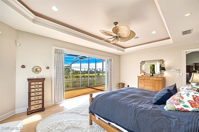 bedroom featuring access to outside, a raised ceiling, visible vents, and baseboards