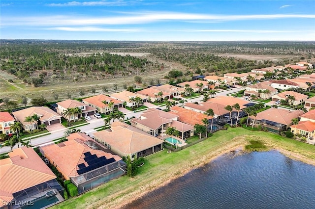 birds eye view of property featuring a residential view and a water view