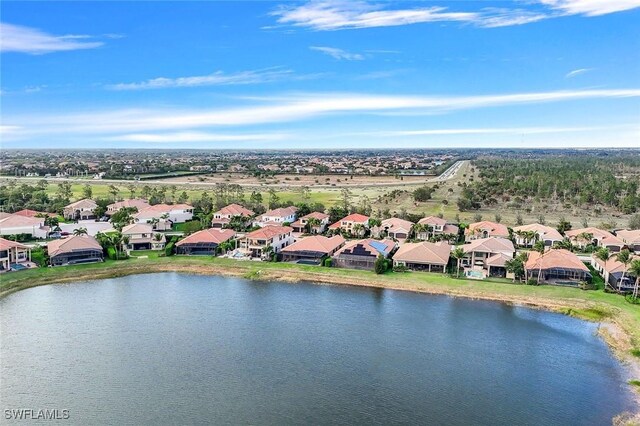 birds eye view of property with a water view and a residential view