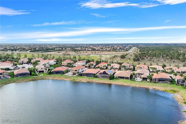 birds eye view of property with a residential view and a water view