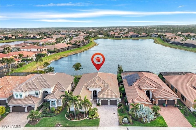 bird's eye view with a water view and a residential view