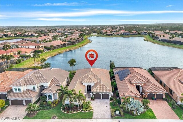 aerial view with a water view and a residential view